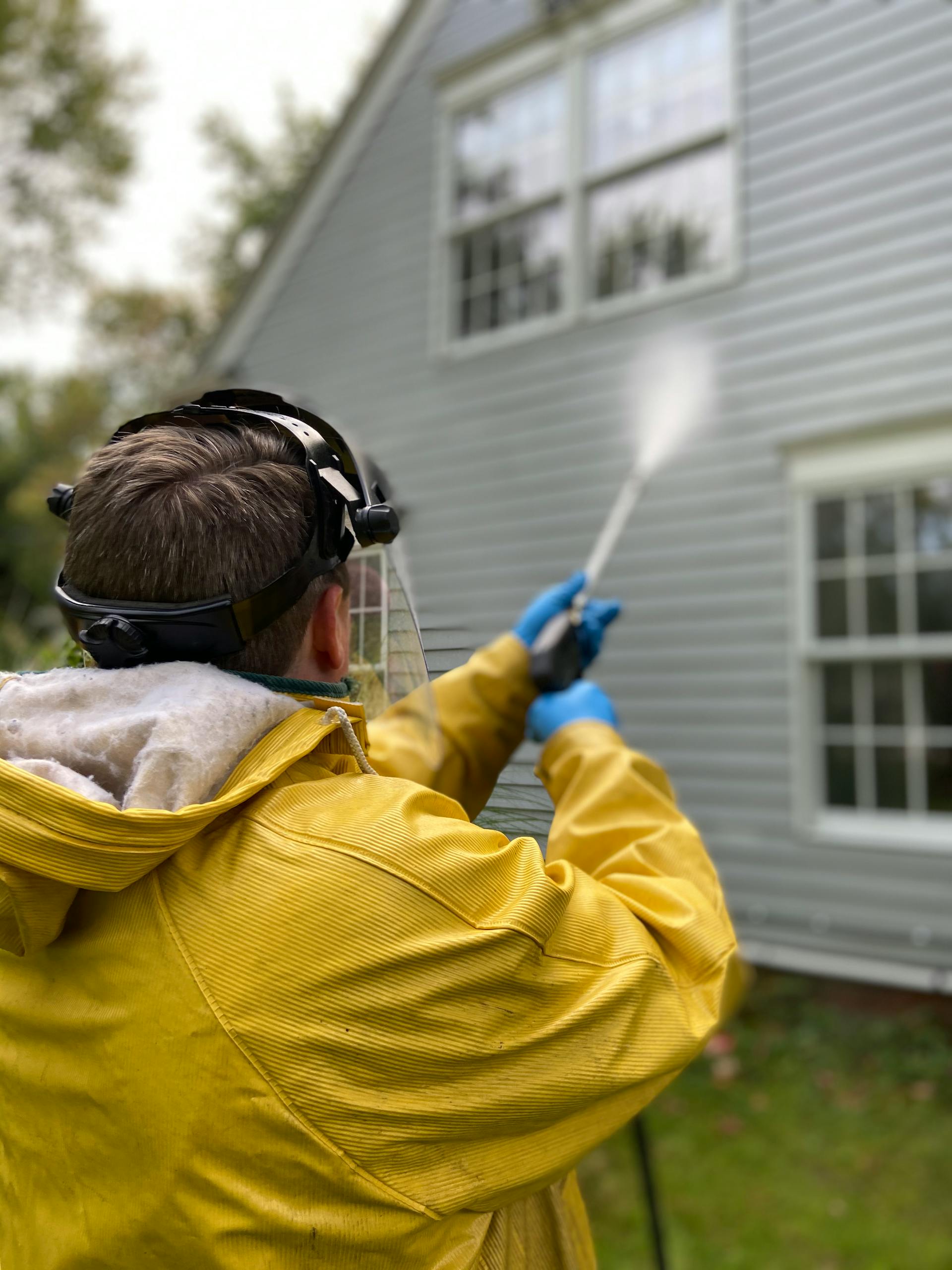 Professional pressure washing a residential home in Kansas City, MO — KC PowerWash